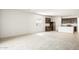 Modern kitchen with dark cabinetry, tile flooring, and island at 2504 S 244Th Dr, Buckeye, AZ 85326