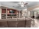 Living room with a built-in entertainment center and fireplace at 25403 N 71St Dr, Peoria, AZ 85383