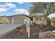 One-story home with two-car garage and landscaped yard at 26631 W Runion Dr, Buckeye, AZ 85396