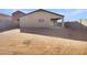 Large backyard with covered patio and new grass at 30613 N Oak Dr, Florence, AZ 85132