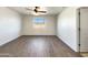 Empty bedroom with wood-look floors and a window at 30613 N Oak Dr, Florence, AZ 85132