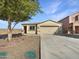 New construction home with two-car garage and desert landscaping at 30613 N Oak Dr, Florence, AZ 85132