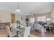 Bright dining area with a glass-top table and open concept design at 44092 W Stonecreek Rd, Maricopa, AZ 85139