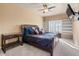 Main bedroom with a king-size bed and built-in shelves at 5350 E Deer Valley Dr # 3418, Phoenix, AZ 85054