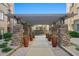 Stone-paved walkway with pergola and potted plants at 5350 E Deer Valley Dr # 3418, Phoenix, AZ 85054