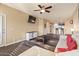Living room boasts an L-shaped sofa and a view of the kitchen at 5350 E Deer Valley Dr # 3418, Phoenix, AZ 85054