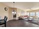 Living room with dark tile floors and comfy furniture at 5350 E Deer Valley Dr # 3418, Phoenix, AZ 85054