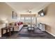 Spacious living room with L-shaped sofa and large TV at 5350 E Deer Valley Dr # 3418, Phoenix, AZ 85054
