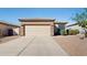 One-story home with a two-car garage and desert landscaping at 6814 E San Cristobal Way, Gold Canyon, AZ 85118