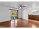 Hardwood floor bedroom with sliding glass door to backyard at 7420 E Via Estrella Ave, Scottsdale, AZ 85258