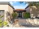 Inviting front entrance with a decorative door and mature landscaping at 7420 E Via Estrella Ave, Scottsdale, AZ 85258