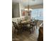 Formal dining room with glass-top table and chandelier at 8846 E Copper Dr, Sun Lakes, AZ 85248