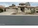 Spanish style home with a two-car garage and desert landscaping at 8846 E Copper Dr, Sun Lakes, AZ 85248