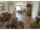 Spacious living room with seating area and view to dining area at 8846 E Copper Dr, Sun Lakes, AZ 85248