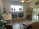 Comfortable living room with fireplace and sliding glass doors to patio at 8846 E Copper Dr, Sun Lakes, AZ 85248