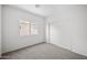 Bedroom with sliding door closet and window overlooking backyard at 885 W Tremaine Ave, Gilbert, AZ 85233