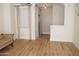 Light and bright hallway with wood floors and a chandelier at 900 S 94Th St # 1065, Chandler, AZ 85224