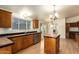 Kitchen features an island and plenty of wood cabinets at 9831 E Broadway Rd, Mesa, AZ 85208