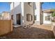 Small side yard with gravel landscaping and sliding glass door at 10268 W Sands Dr # 490, Peoria, AZ 85383