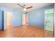 Bright bedroom with light wood flooring and ensuite bath at 12601 N Augusta Dr, Sun City, AZ 85351