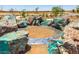 Unique circular metal inlay surrounded by colorful rocks at 12631 W Parkway Ln, Avondale, AZ 85323