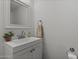 Small bathroom with white vanity, mirror, and toilet at 1407 N 44Th St, Phoenix, AZ 85008