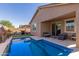 Private backyard with pool and patio furniture at 14196 W Georgia Dr, Surprise, AZ 85379