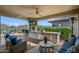 Outdoor kitchen with grill, seating area, and stunning mountain views at 17910 E Cindercone Rd, Rio Verde, AZ 85263