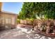 Landscaped backyard with a water fountain at 17937 W Weatherby Dr, Surprise, AZ 85374