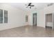 Spacious bedroom with ceiling fan and ensuite bathroom access at 17937 W Weatherby Dr, Surprise, AZ 85374