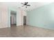 Bright bedroom with two windows and a view of the backyard at 17937 W Weatherby Dr, Surprise, AZ 85374