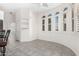 Bright kitchen nook with tile floor and built-in shelving at 17937 W Weatherby Dr, Surprise, AZ 85374