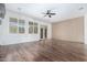 Spacious living room with hardwood floors and ceiling fan at 17937 W Weatherby Dr, Surprise, AZ 85374
