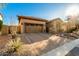 Front view of a house with a two-car garage and brick driveway at 1823 N Atwood --, Mesa, AZ 85207