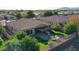 Aerial view of a house with a backyard patio, fire pit, and lush landscaping at 19204 W Oregon Ave, Litchfield Park, AZ 85340