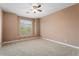 Well-lit bedroom featuring neutral walls and ceiling fan at 2305 W Long Shadow Trl, Phoenix, AZ 85085