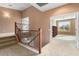 Upper-level hallway with carpet flooring and built-in shelving at 2305 W Long Shadow Trl, Phoenix, AZ 85085