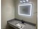 Bathroom featuring granite vanity and lighted mirror at 2608 W Berridge Ln # 220, Phoenix, AZ 85017