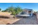 Backyard view showcasing a trampoline and gravel surface at 28658 N Geode Dr, San Tan Valley, AZ 85143