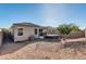 Backyard view, featuring a trampoline and gravel ground at 28658 N Geode Dr, San Tan Valley, AZ 85143