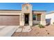 Single-story home with a two-car garage and desert landscaping at 28658 N Geode Dr, San Tan Valley, AZ 85143