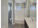 Clean bathroom with a bathtub, shower, and modern vanity at 3576 N Carlton St, Buckeye, AZ 85396