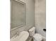 Simple bathroom with white toilet and sink at 3576 N Carlton St, Buckeye, AZ 85396