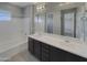 Modern bathroom with double vanity and soaking tub at 3576 N Carlton St, Buckeye, AZ 85396