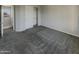Carpeted bedroom with walk-in closet at 3576 N Carlton St, Buckeye, AZ 85396