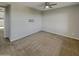 Cozy carpeted bedroom with ceiling fan at 3576 N Carlton St, Buckeye, AZ 85396