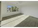 Bright bedroom with carpeting, large windows, and sliding door to balcony at 3576 N Carlton St, Buckeye, AZ 85396