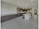 Open concept kitchen with island and stainless steel appliances at 3576 N Carlton St, Buckeye, AZ 85396