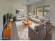 Spacious living room featuring modern furniture and large windows at 3576 N Carlton St, Buckeye, AZ 85396