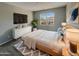 Comfortable main bedroom with a large bed and plenty of natural light at 3576 N Carlton St, Buckeye, AZ 85396